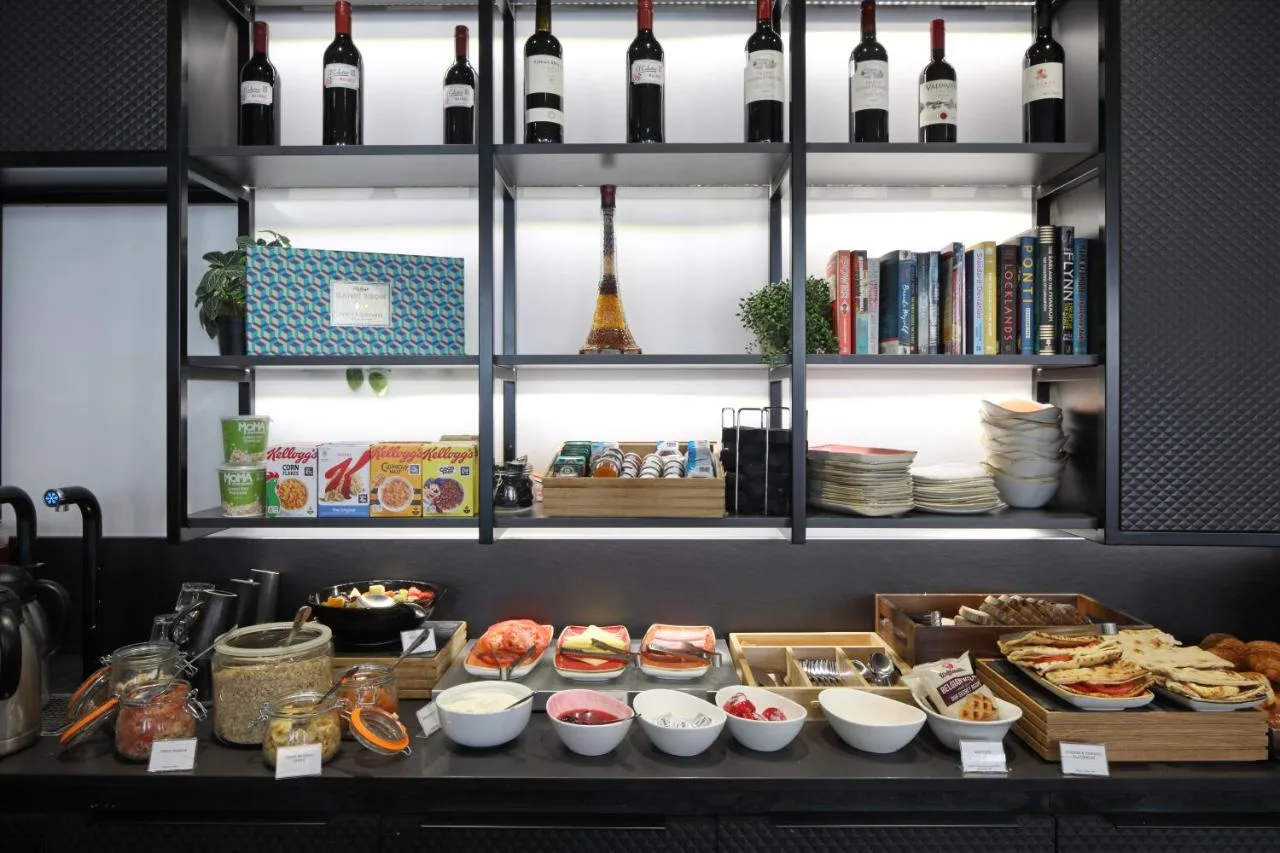 a shelf filled with lots of food and wine bottles at The Z Hotel Victoria in London
