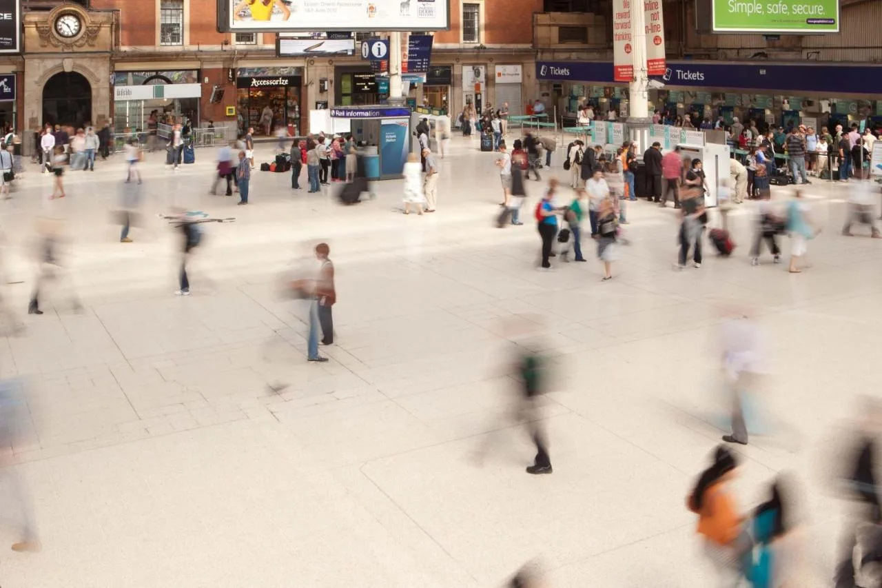 a crowd of people walking in a shopping mall at The Z Hotel Victoria in London